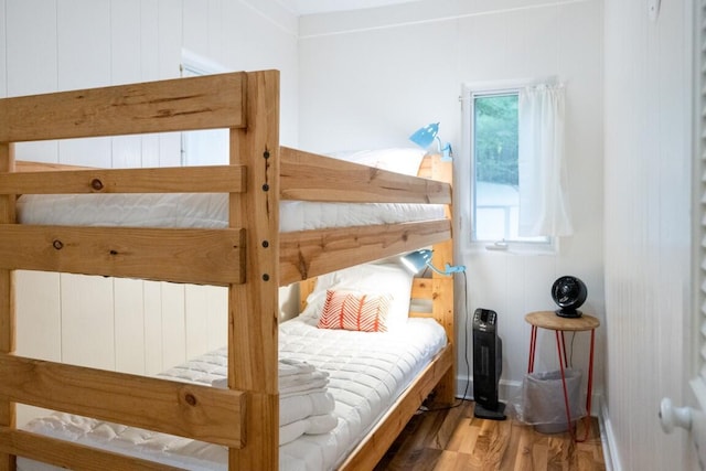 bedroom with wood finished floors