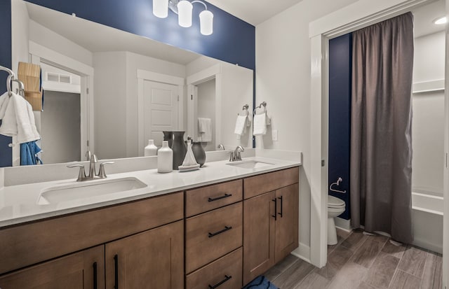 6232 Marsh, Ypsilanti, MI 48197 - bathroom with toilet, wood finish floors, double vanity, and baseboards