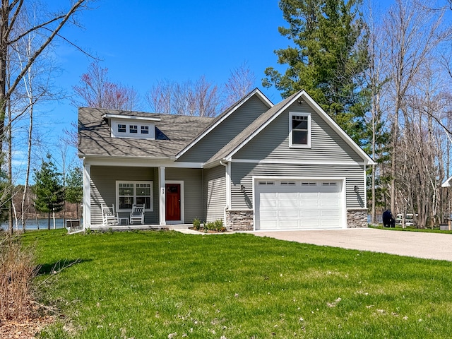 153 Tippi Trl, Buckley, MI 49620 - view of front of property with driveway, a front yard, stone siding, a porch, and a shingled roof