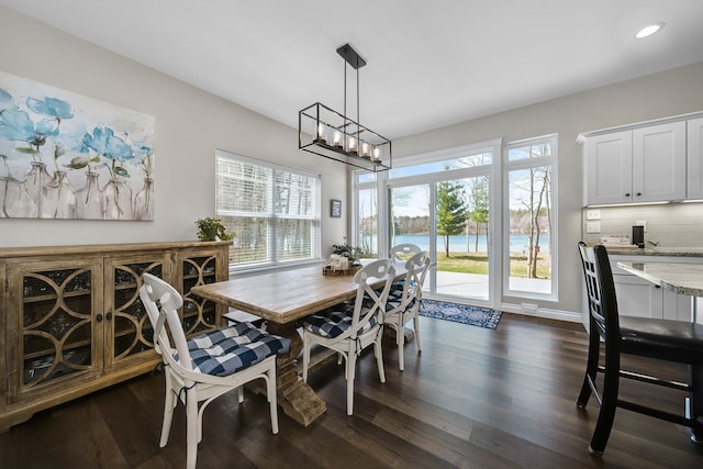 153 Tippi Trl, Buckley, MI 49620 - dining area featuring dark wood-style floors, recessed lighting, and a water view