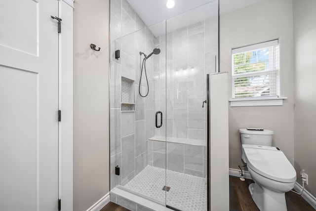 153 Tippi Trl, Buckley, MI 49620 - bathroom with baseboards, wood finished floors, a stall shower, toilet, and recessed lighting