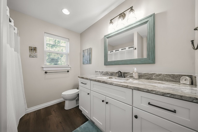 153 Tippi Trl, Buckley, MI 49620 - full bathroom featuring wood finished floors, vanity, toilet, and baseboards