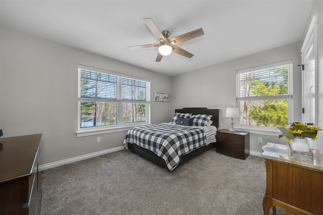 153 Tippi Trl, Buckley, MI 49620 - bedroom with baseboards, carpet floors, and a ceiling fan