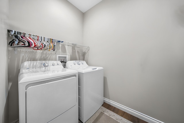 153 Tippi Trl, Buckley, MI 49620 - washroom with washer and clothes dryer, wood finished floors, and baseboards