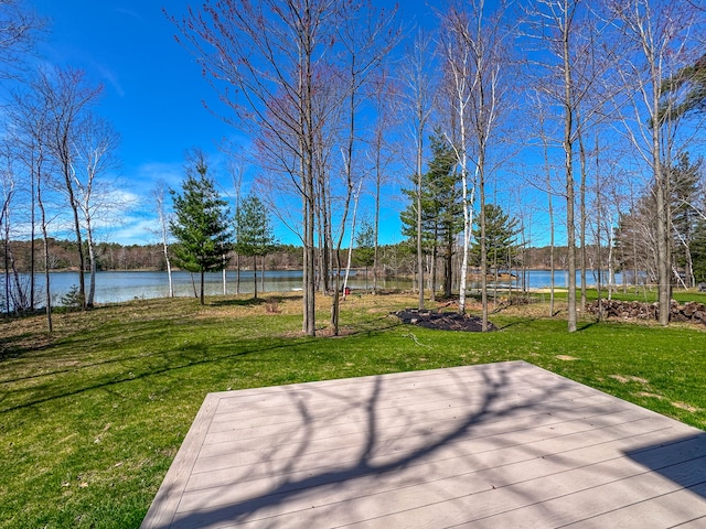 153 Tippi Trl, Buckley, MI 49620 - wooden terrace with a water view and a lawn