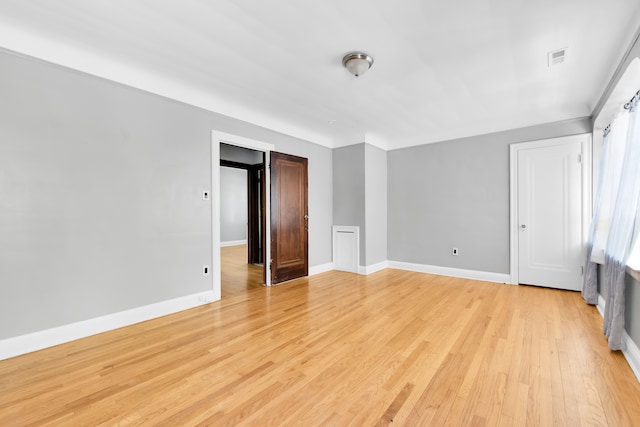 3835 Courville St, Detroit, MI 48224 - empty room with light wood-style floors and baseboards