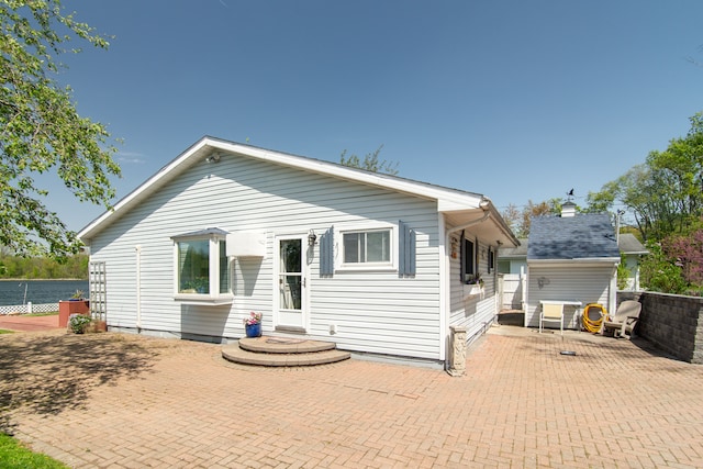 5303 Lake Rd, Reading, MI 49274 - rear view of property with a patio area and fence