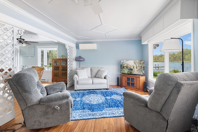 5303 Lake Rd, Reading, MI 49274 - living room featuring a ceiling fan, wood finished floors, a wall mounted air conditioner, ornamental molding, and a wainscoted wall