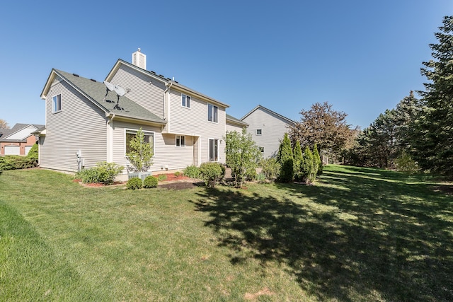 1953 Harley Ct, Ann Arbor, MI 48103 - rear view of house with a chimney and a yard