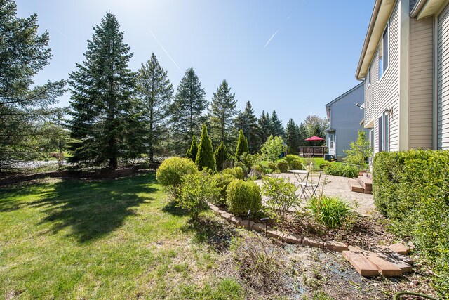 1953 Harley Ct, Ann Arbor, MI 48103 - view of green lawn featuring a patio area