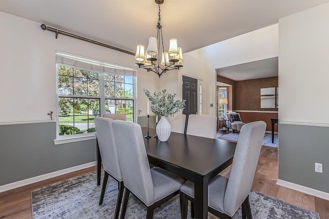 1953 Harley Ct, Ann Arbor, MI 48103 - dining area with a chandelier, wood finished floors, and baseboards