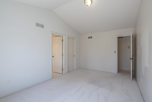 1953 Harley Ct, Ann Arbor, MI 48103 - unfurnished bedroom with lofted ceiling and light colored carpet