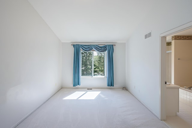 1953 Harley Ct, Ann Arbor, MI 48103 - carpeted empty room with vaulted ceiling