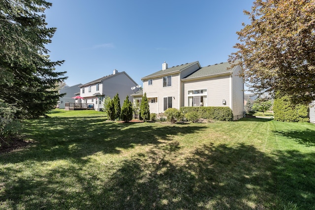 1953 Harley Ct, Ann Arbor, MI 48103 - rear view of property with a yard and a chimney