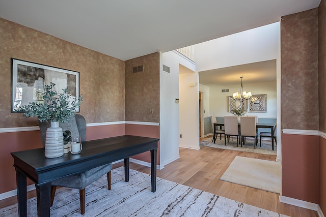 1953 Harley Ct, Ann Arbor, MI 48103 - home office featuring a chandelier, wood finished floors, and baseboards