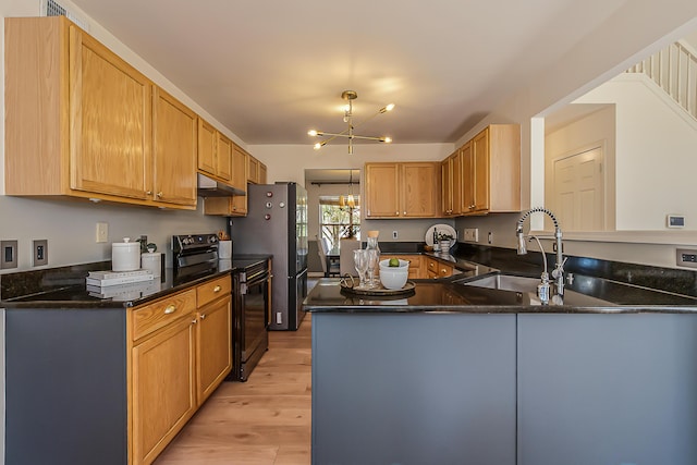 1953 Harley Ct, Ann Arbor, MI 48103 - kitchen with black electric range, a sink, light wood-style floors, a peninsula, and a chandelier