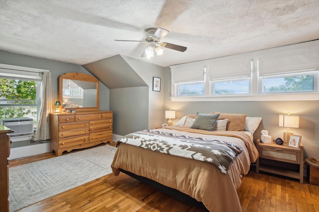 1000 W Ganson St, Jackson, MI 49202 - bedroom featuring a textured ceiling, wood-type flooring, and ceiling fan