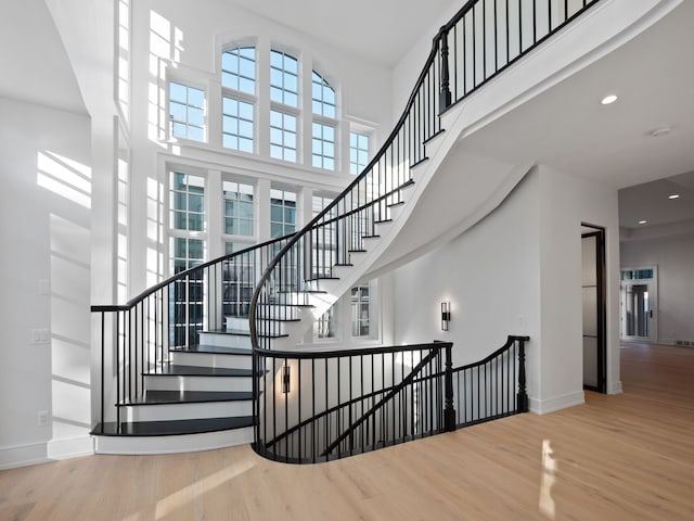 330 Ferndale Ave, Birmingham, MI 48009 - stairs with a towering ceiling, wood finished floors, baseboards, and recessed lighting