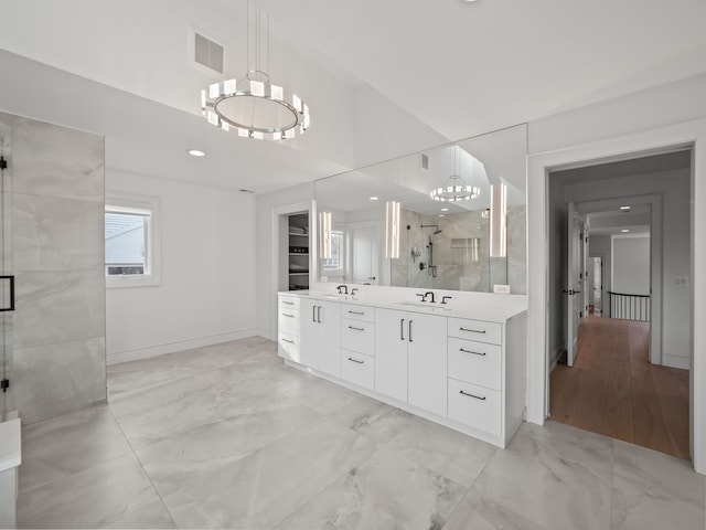 330 Ferndale Ave, Birmingham, MI 48009 - full bath featuring a chandelier, a stall shower, marble look tiles, vanity, and baseboards