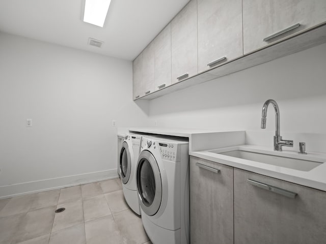 330 Ferndale Ave, Birmingham, MI 48009 - laundry room featuring washer and clothes dryer, cabinet space, baseboards, and light tile patterned flooring
