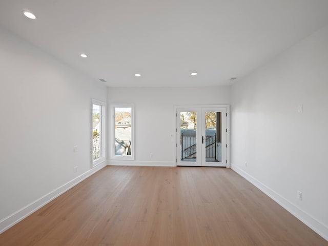 330 Ferndale Ave, Birmingham, MI 48009 - unfurnished room with light wood finished floors, recessed lighting, baseboards, and french doors