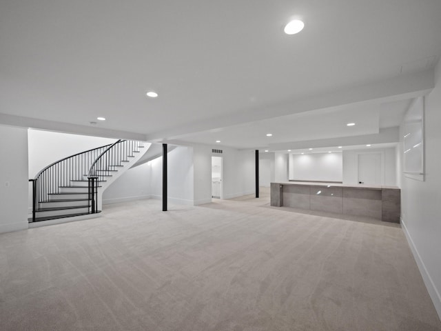 330 Ferndale Ave, Birmingham, MI 48009 - finished below grade area with light carpet, baseboards, stairway, and recessed lighting