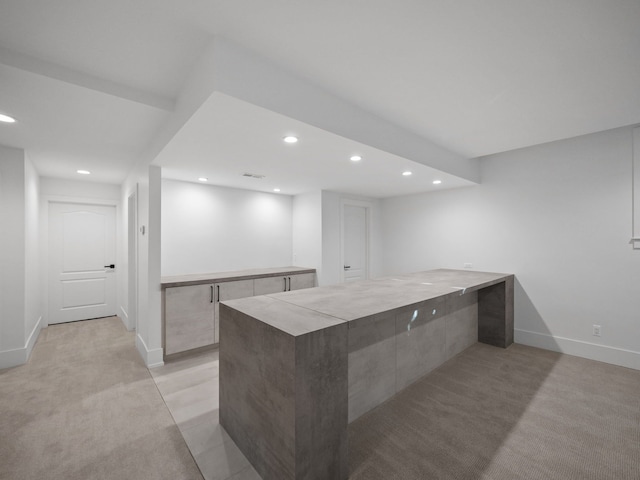 330 Ferndale Ave, Birmingham, MI 48009 - kitchen with recessed lighting, a peninsula, baseboards, modern cabinets, and light colored carpet