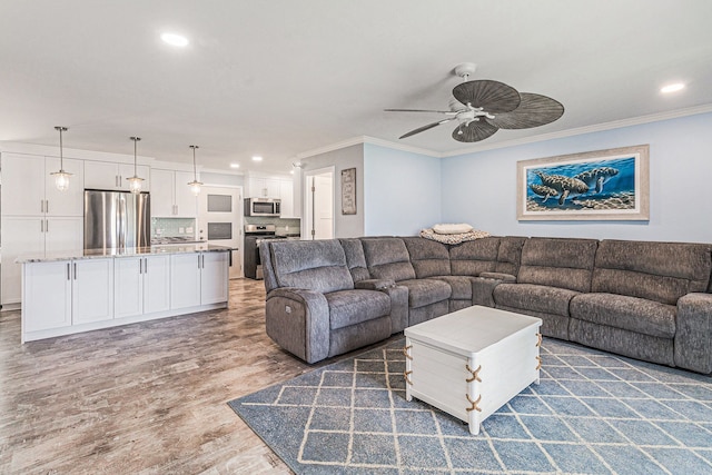 7262 Hatchery Rd, Waterford, MI 48327 - living room featuring a ceiling fan, crown molding, recessed lighting, and light wood-type flooring