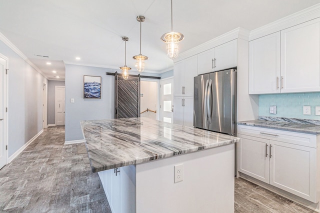 7262 Hatchery Rd, Waterford, MI 48327 - kitchen featuring freestanding refrigerator, white cabinets, decorative backsplash, a center island, and ornamental molding