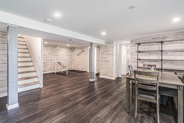 7262 Hatchery Rd, Waterford, MI 48327 - dining area with baseboards, stairs, wood finished floors, recessed lighting, and wood walls