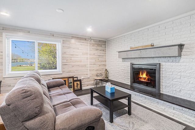 7262 Hatchery Rd, Waterford, MI 48327 - living room featuring ornamental molding, a brick fireplace, and wood finished floors