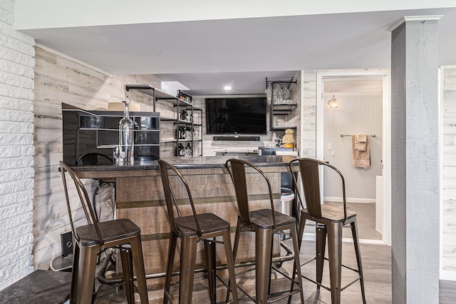 7262 Hatchery Rd, Waterford, MI 48327 - indoor wet bar with wood finished floors and wood walls