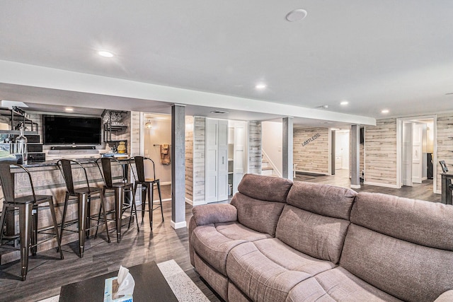 7262 Hatchery Rd, Waterford, MI 48327 - living room with stairs, wood finished floors, recessed lighting, bar, and wood walls