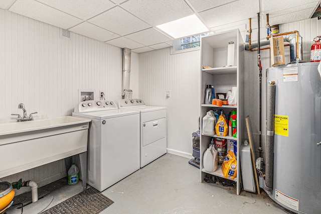7262 Hatchery Rd, Waterford, MI 48327 - laundry area featuring gas water heater and separate washer and dryer
