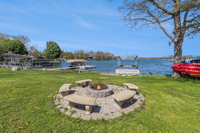 7262 Hatchery Rd, Waterford, MI 48327 - view of green lawn with a fire pit, a dock, a water view, and boat lift