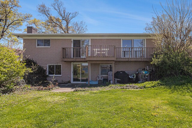 7262 Hatchery Rd, Waterford, MI 48327 - back of property with brick siding, a chimney, a lawn, and a deck