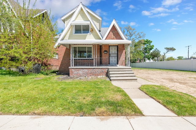 15430 Mendota St, Detroit, MI 48238 - view of front facade with brick siding and a porch