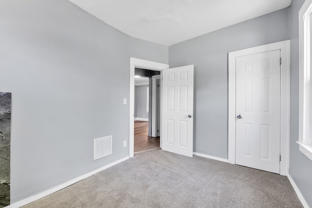 15430 Mendota St, Detroit, MI 48238 - unfurnished bedroom featuring carpet flooring and baseboards