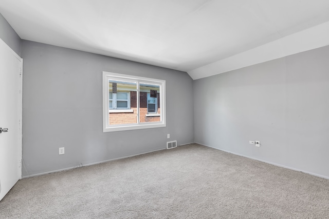 15430 Mendota St, Detroit, MI 48238 - carpeted empty room featuring lofted ceiling and baseboards