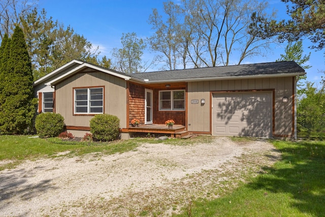 ranch-style house featuring driveway and a garage