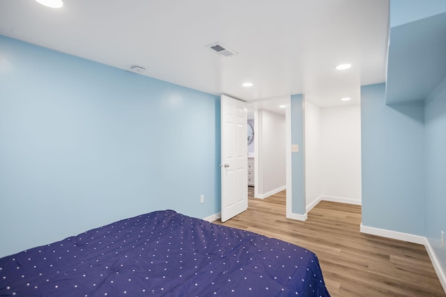 68687 M-43, South Haven, MI 49090 - unfurnished bedroom featuring wood finished floors, baseboards, and recessed lighting