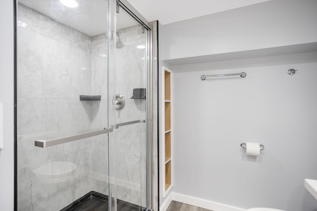 68687 M-43, South Haven, MI 49090 - full bath featuring a shower stall, toilet, and wood finished floors