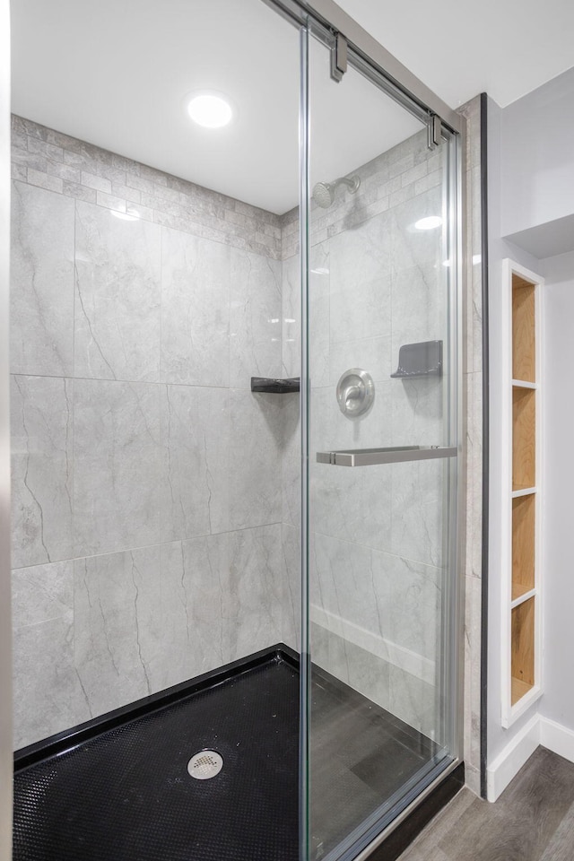 68687 M-43, South Haven, MI 49090 - full bathroom featuring a shower stall, wood finished floors, and baseboards