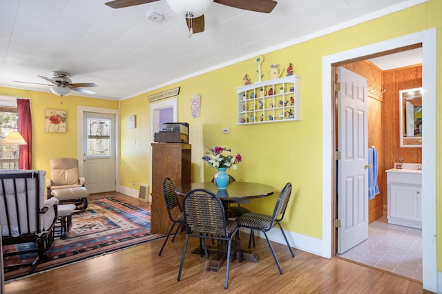 68687 M-43, South Haven, MI 49090 - dining space featuring ceiling fan, wood finished floors, and baseboards