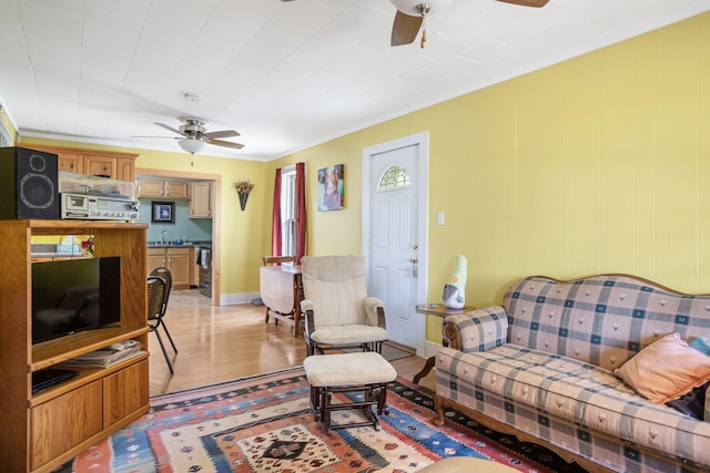 68687 M-43, South Haven, MI 49090 - living room featuring ceiling fan, light wood-type flooring, and baseboards