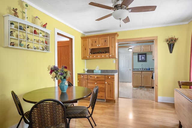 68687 M-43, South Haven, MI 49090 - dining area featuring ornamental molding, light wood-type flooring, and ceiling fan