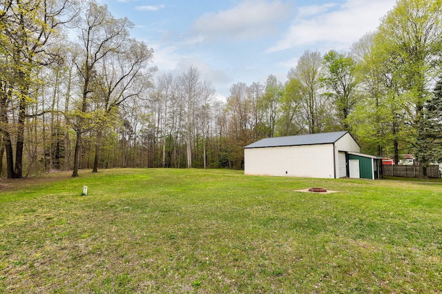 68687 M-43, South Haven, MI 49090 - view of yard with a pole building, an outdoor structure, and an outdoor fire pit
