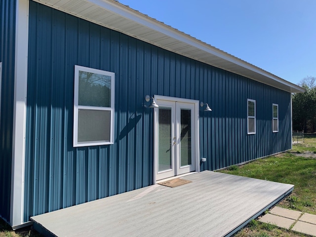 back of house featuring french doors and a deck