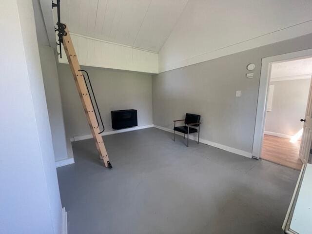 519 Whaley St, Cadillac, MI 49601 - unfurnished room featuring concrete flooring, lofted ceiling, and baseboards