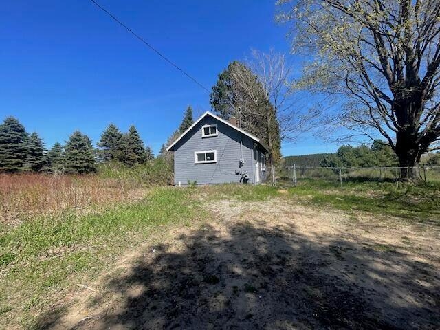 519 Whaley St, Cadillac, MI 49601 - view of property exterior featuring fence